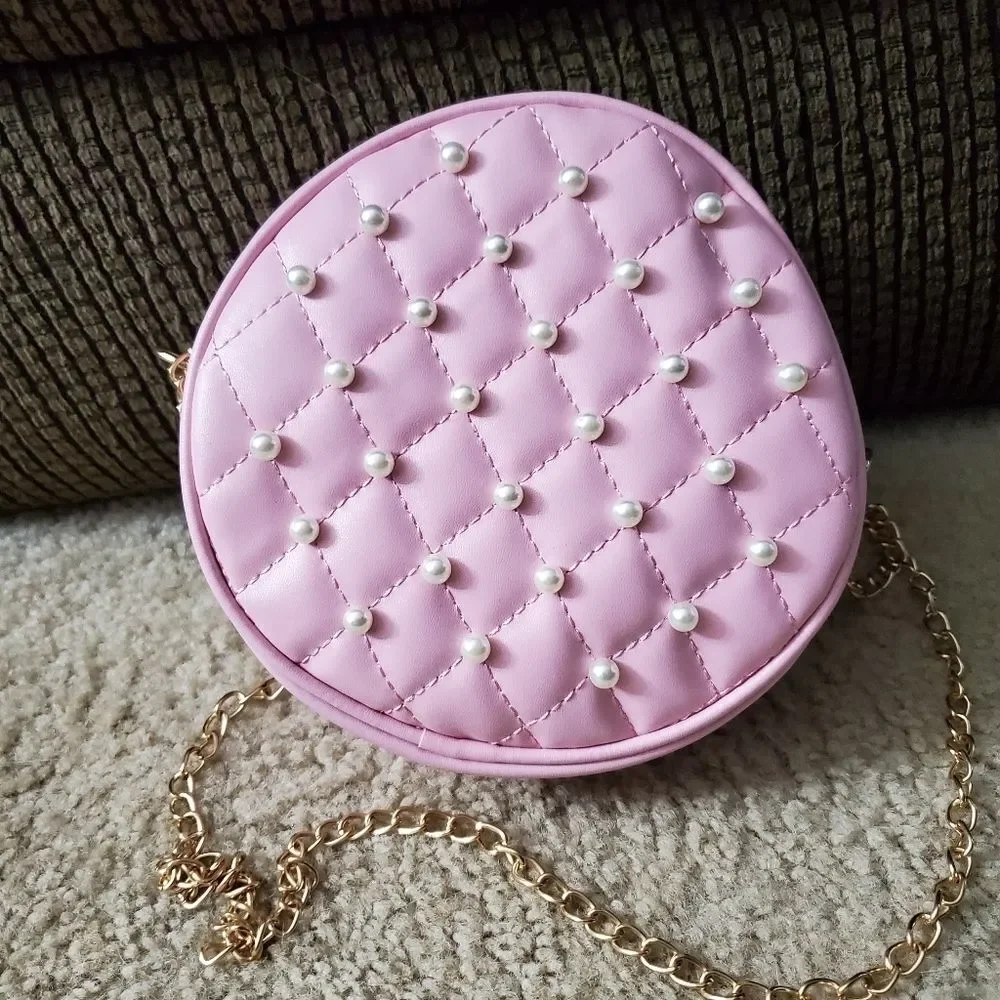 Round pink crossbody with faux pearls